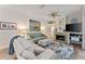 Living room with fireplace, shiplap wall and comfortable seating at 11921 Whistling Way, Lakewood Ranch, FL 34202