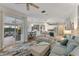 Open living space with views of the kitchen and pool at 11921 Whistling Way, Lakewood Ranch, FL 34202