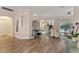 Spacious living room with hardwood floors, a sitting area, and views to the pool at 11921 Whistling Way, Lakewood Ranch, FL 34202