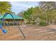 Community playground with swings and a covered picnic area at 11921 Whistling Way, Lakewood Ranch, FL 34202