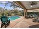 Inviting pool and spa area with ample seating and a screened enclosure at 11921 Whistling Way, Lakewood Ranch, FL 34202