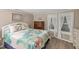 Bedroom with a double bed, tropical bedding, and hardwood floors at 1210 41St Avenue E Dr, Ellenton, FL 34222