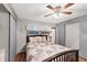 Bedroom with a double bed, ceiling fan, and sliding door closet at 1210 41St Avenue E Dr, Ellenton, FL 34222