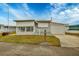 Single-wide manufactured home with carport and small front yard at 1210 41St Avenue E Dr, Ellenton, FL 34222