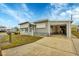 Single-story home with carport and landscaped yard at 1210 41St Avenue E Dr, Ellenton, FL 34222