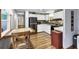 Galley kitchen with white cabinets and modern appliances at 1210 41St Avenue E Dr, Ellenton, FL 34222