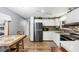 Clean kitchen with white cabinets and stainless steel appliances at 1210 41St Avenue E Dr, Ellenton, FL 34222