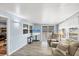 Living room with light walls and sliding glass door at 1210 41St Avenue E Dr, Ellenton, FL 34222
