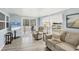 Living room with a view of the porch and flat-screen TV at 1210 41St Avenue E Dr, Ellenton, FL 34222