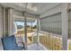 Covered porch with railing overlooking the community at 1210 41St Avenue E Dr, Ellenton, FL 34222