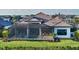 Luxury home with expansive backyard, pool, and outdoor kitchen at 1210 Blue Shell Loop, Sarasota, FL 34240