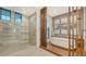 Modern bathroom with a glass-enclosed shower and a freestanding tub at 1210 Blue Shell Loop, Sarasota, FL 34240