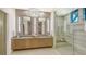 Elegant bathroom with double vanity, large shower, and modern fixtures at 1210 Blue Shell Loop, Sarasota, FL 34240