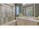 Spa-like bathroom with a walk-in shower and modern vanity at 1210 Blue Shell Loop, Sarasota, FL 34240