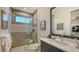 Modern bathroom with a walk-in shower and gray tile at 1210 Blue Shell Loop, Sarasota, FL 34240