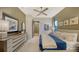 Serene bedroom with ensuite bathroom and large windows at 1210 Blue Shell Loop, Sarasota, FL 34240
