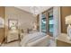 Spacious bedroom with large windows and neutral color palette at 1210 Blue Shell Loop, Sarasota, FL 34240