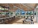 Community clubhouse with bar, pool view, and seating at 1210 Blue Shell Loop, Sarasota, FL 34240