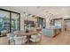 Open concept dining room with large table, modern lighting, and kitchen views at 1210 Blue Shell Loop, Sarasota, FL 34240