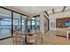 Elegant dining room with round table, modern chandelier, and access to outdoor patio at 1210 Blue Shell Loop, Sarasota, FL 34240