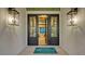 Grand entryway with double doors and statement lighting at 1210 Blue Shell Loop, Sarasota, FL 34240