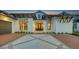 Elegant home with double front doors and brick driveway at 1210 Blue Shell Loop, Sarasota, FL 34240