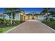 Stunning two-story home with a three-car garage and brick driveway at 1210 Blue Shell Loop, Sarasota, FL 34240