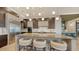 Spacious kitchen boasts an island, stainless steel appliances, and modern cabinetry at 1210 Blue Shell Loop, Sarasota, FL 34240