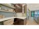 Built-in kitchen desk with white countertop and stylish cabinetry at 1210 Blue Shell Loop, Sarasota, FL 34240
