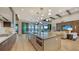 Modern kitchen with large island, stainless steel appliances, and open floor plan at 1210 Blue Shell Loop, Sarasota, FL 34240