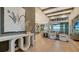 Light and airy living room with hardwood floors and modern decor at 1210 Blue Shell Loop, Sarasota, FL 34240