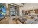 Modern living room with a large sectional sofa and kitchen views at 1210 Blue Shell Loop, Sarasota, FL 34240