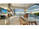 Elegant outdoor kitchen overlooking the pool and lake at 1210 Blue Shell Loop, Sarasota, FL 34240