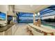 Modern outdoor kitchen with granite counters and pool view at 1210 Blue Shell Loop, Sarasota, FL 34240