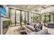 Outdoor living space with fireplace and views into the home at 1210 Blue Shell Loop, Sarasota, FL 34240