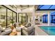 Relaxing outdoor living space with pool and kitchen views at 1210 Blue Shell Loop, Sarasota, FL 34240