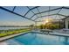 Inviting pool and patio with spa, lounge chairs and waterfront views at 1210 Blue Shell Loop, Sarasota, FL 34240