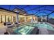 Relaxing pool and spa with covered lanai and outdoor kitchen at 1210 Blue Shell Loop, Sarasota, FL 34240