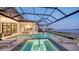 Resort-style pool and spa with covered lanai, offering water views at 1210 Blue Shell Loop, Sarasota, FL 34240