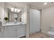 Clean bathroom with a vanity, shower, and toilet at 12550 Ghiberti Cir # 101, Venice, FL 34293