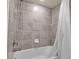 Bathroom with a bathtub and shower combination at 12550 Ghiberti Cir # 101, Venice, FL 34293