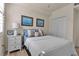 Well-lit bedroom featuring a double bed and built-in closet at 12550 Ghiberti Cir # 101, Venice, FL 34293