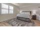 Bright bedroom with a king-size bed and plenty of closet space at 12550 Ghiberti Cir # 101, Venice, FL 34293