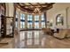 Spacious community clubhouse lobby with fireplace and seating at 12550 Ghiberti Cir # 101, Venice, FL 34293