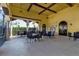 Relaxing community patio with tables and chairs at 12550 Ghiberti Cir # 101, Venice, FL 34293