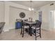 Dining area with dark wood table and chairs, view of living room at 12550 Ghiberti Cir # 101, Venice, FL 34293