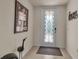 Entryway with decorative glass door and ornate door hardware at 12550 Ghiberti Cir # 101, Venice, FL 34293