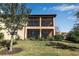 Townhome exterior showcasing a two-story lanai at 12550 Ghiberti Cir # 101, Venice, FL 34293