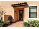 Townhome front entrance with brick walkway and small garden at 12550 Ghiberti Cir # 101, Venice, FL 34293