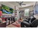 Home game room with a leather couch and sports memorabilia at 12550 Ghiberti Cir # 101, Venice, FL 34293